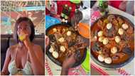 Hajia Bintu eats large pot of fufu with long nails in video; causes stir