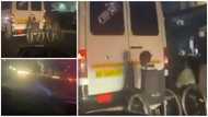 Accra we dey: 2 men in wheelchair cling onto the back of moving vehicle in video