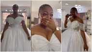Emotional moment young lady sheds tears of joy as she wears white wedding gown in viral video