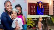 Ghanaian actress Akuapem Poloo looks elegant in a white turtleneck top and a loose sleeveless gown at Yvonne Nelson's book launch