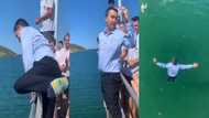 Teacher caught on tape playing with his students, jumps into river fully dressed, children scream & cheer