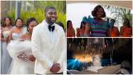 Plus-size Ghanaian flaunts curves in an elegant white gown while praying fervently after vows