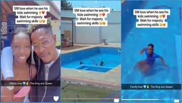 Happy Shatta Wale looks on as his kids Cherissa & Majesty swim in his SM pool