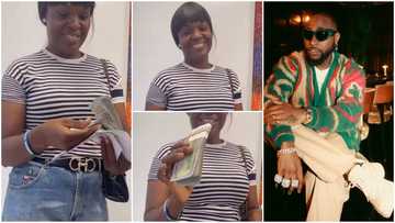 Video as Davido finally fulfils promise to hotel worker, she shows off $10,000 cash she received from singer