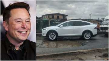 Expensive Tesla electric car seen trying to avoid big pothole in town