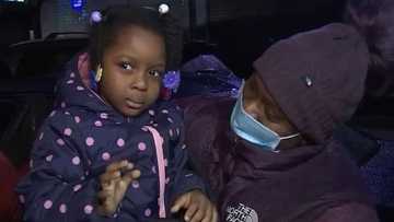 Heroic man escaping apartment fire stops to rescue young girl; mother shows appreciation