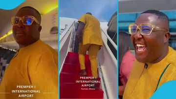 Oheneba Jude displays as he boards flight from Kumasi airport to Accra: "Alupray vibes"