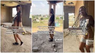 Abroad-based woman looks impressed by house her parents are building in Africa