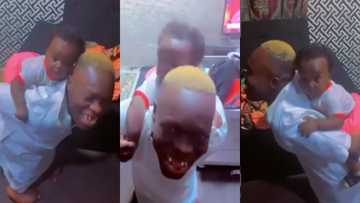 Shatta Bandle causes stir; drops rare video carrying a baby at his back