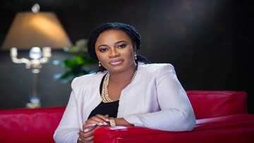 Charlotte Osei in victory smile as she steps out in her fashionable white dress