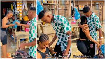 Man stops pretty lady on the road to give her new handbag, she jumps and kneels to thank him in video