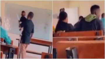 Kind heart: Male lecturer carries little baby as mother receives lecture, many hail him