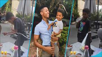 KiDi sings Likor, video of his son jumping happily from his seat to dance melts hearts