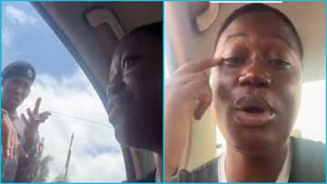 Brave Ghanaian lady refuses to be searched by 2 police officers who said she looked suspicious