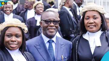 Acting Chief Justice Baffoe-Bonnie swears his wife in as a Notary Public
