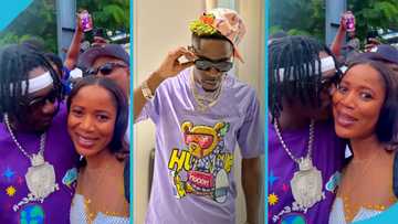 Shatta Wale gives a fan a peck in a video, she blushes and asks for more
