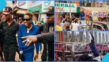 Shatta Wale touches down in Kumasi, sprays money into crowd at the airport, peeps react to video