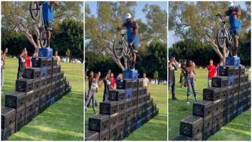Man takes crate challenge to another level; climbs with bicycle in video