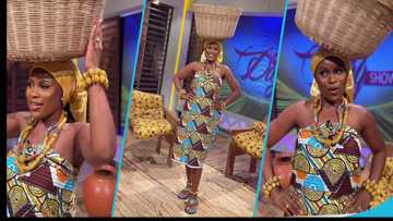 Berla Mundi tries to balance an empty handwoven basket on her head, funny video drops