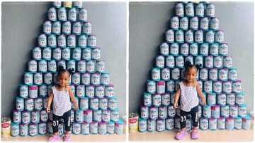 Mum posts photo of her baby and cans of milk she consumed, image goes viral; "87 tins of milk in 12 months"