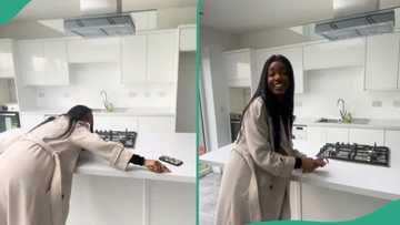 Lady buys a posh house at age 26, celebrates and shows interior in viral video