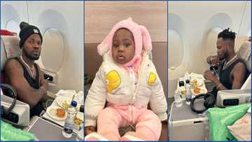 Fameye flies first class, shares photos of his journey and flaunts cute son