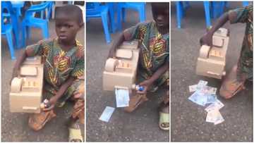 Young African boy creates his own 'ATM', dispenses new notes from it