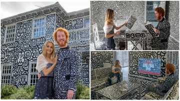 28-year-old man decorates his house with black and white doodle designs, making it look unique