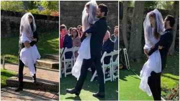 Groom warms hearts after carrying bride's disabled twin sister to their wedding