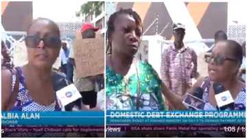 "Give us our money": Elderly lady brings mentally challenged dependents to join picketing over unpaid coupons