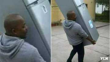Man carries away fridge he bought for girlfriend after catching her cheating (photo)