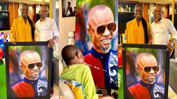 Fadda Dickson splashes cash on physically challenged artist who used his mouth draw a painting of him