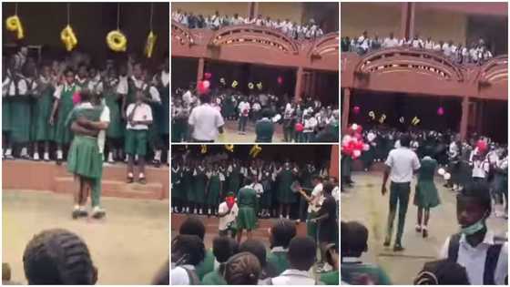 High school students show love; boy kneels for girl in viral video as they hug