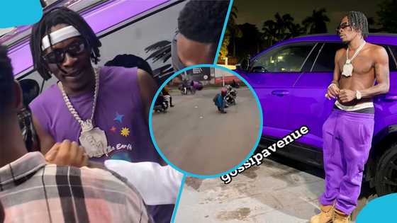 Shatta Wale fans invade busy street as he sprays cash out of purple Lamborghini, video