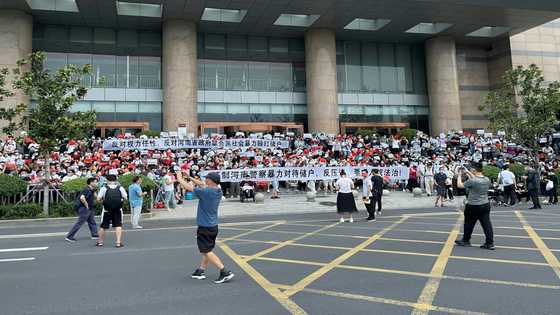 China banks to repay some customers after mass protests