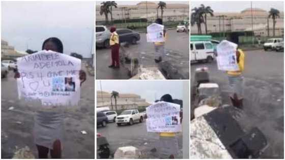 Video goes viral as lady storms town with placard of boyfriend's name and photos to beg for forgiveness
