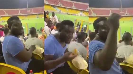 Hearts fan videoed eating banku & okro at stadium while watching match