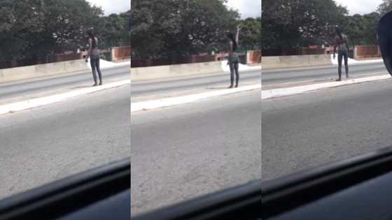 Lady pours 'akpeteshie' on road to Jubilee House to pronounce curses in video