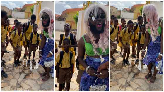 DJ Azonto gifts young school kids money as they happily sing with him in trending video