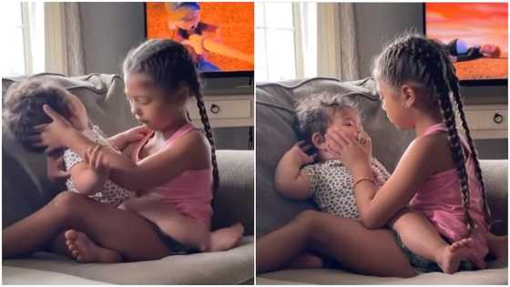 Emotional moment little girl makes baby sister to stop crying; wipes her tears in viral video