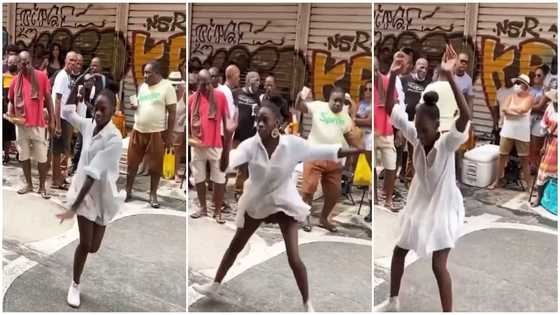Pretty lady keeps legs apart, shows off sweet dance moves on street, people drool over her in video