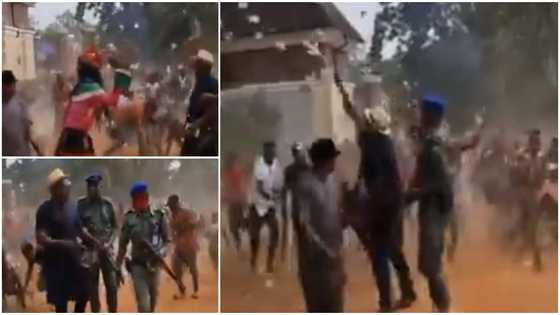 Man Makes it Rain on Street, Throws Wads of Cash for People, a Masquerade Joined in Picking the Money in Video