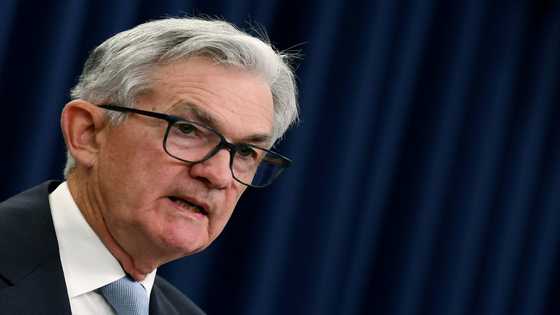 Asian markets fall with Wall St after Fed rate hike, warning