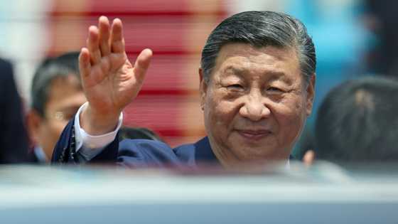 Xi warns protectionism 'leads nowhere' as he arrives in Vietnam