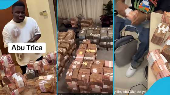 Abu Trica shows off room littered with numerous stacks of cash: "Where una de see this money"