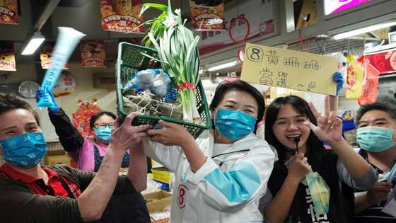Taiwanese politicians flaunt good luck veggies on campaign trail