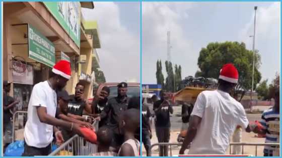 Black Sherif turns Santa Claus as he blesses street kids with food on Christmas Day at Jamestown