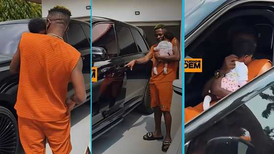 Shatta Wale hides his new daughter's face as he bonds with her inside his East Legon mansion