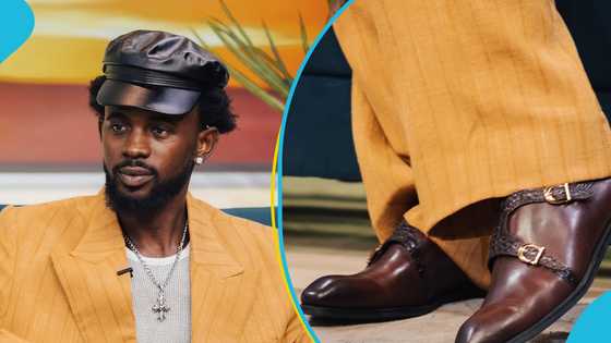 Black Sherif dons stylish custom-made suit and expensive designer shoes