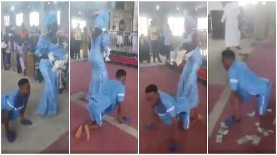 Cash rains as paraplegic man dance-crawls with wife to the altar for their child dedication in new video